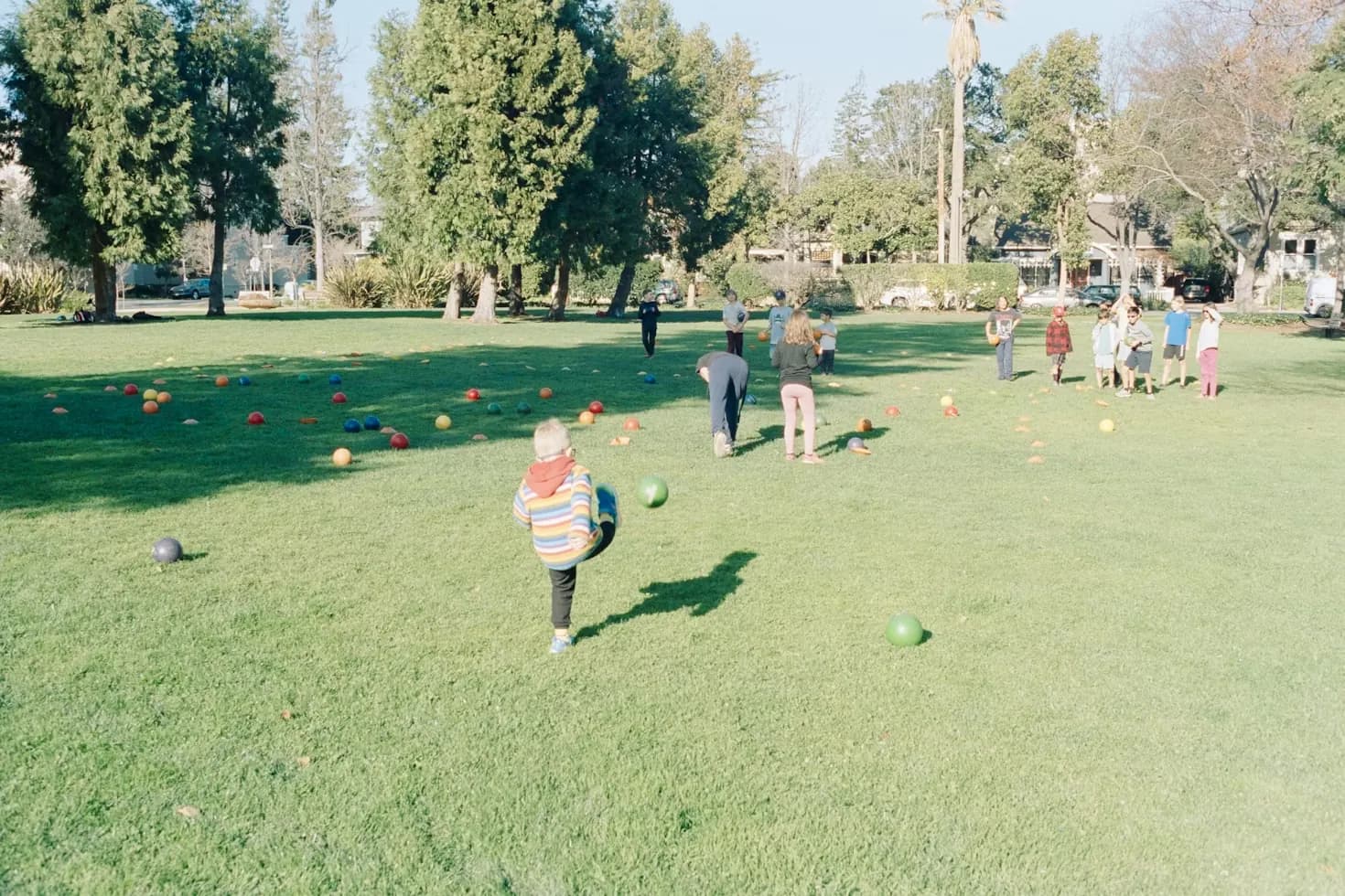 Children playing outdoors in a village setting